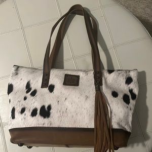 STS Ranchwear classic cowhide handbag or shoulder bag. Concealed carry pocket.